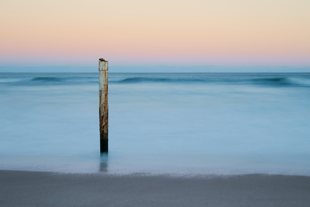 white post on shore