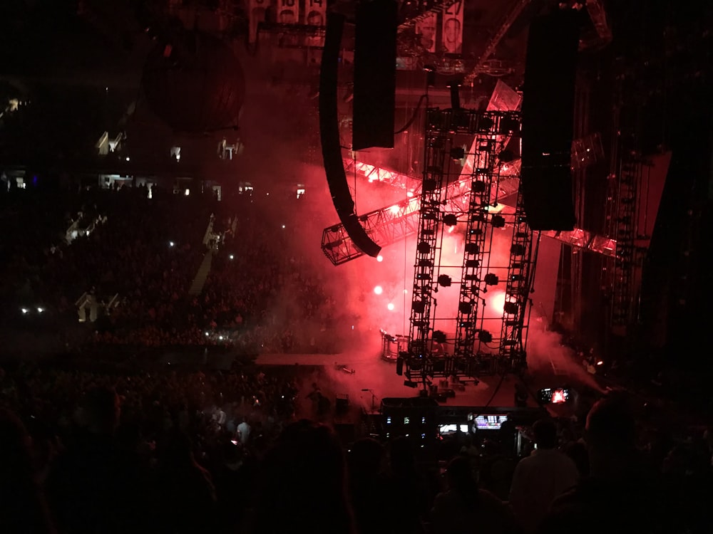 a large crowd of people watching a concert