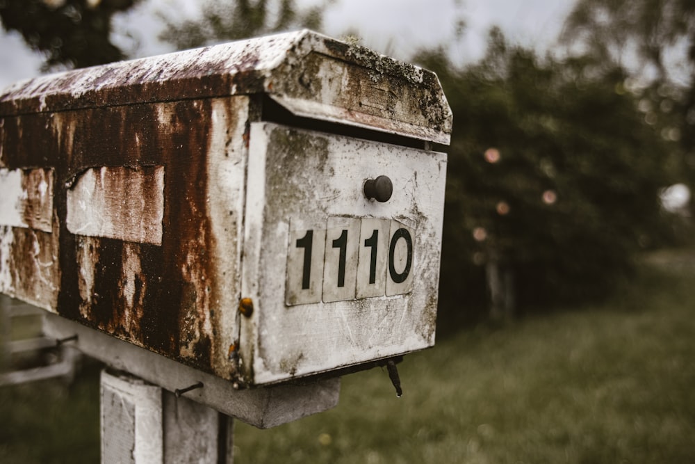 white 110 wooden mail box