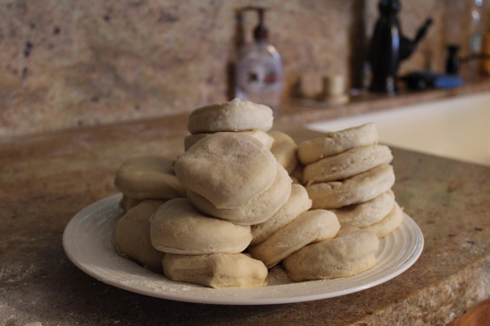 pile of unbaked bread slices on plate