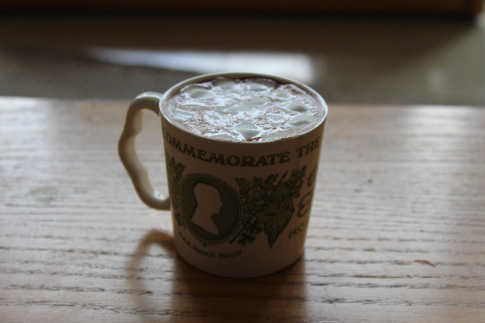 white ceramic mug on table