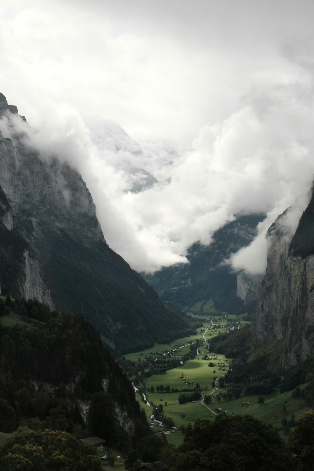 a view of a valley with mountains in the background