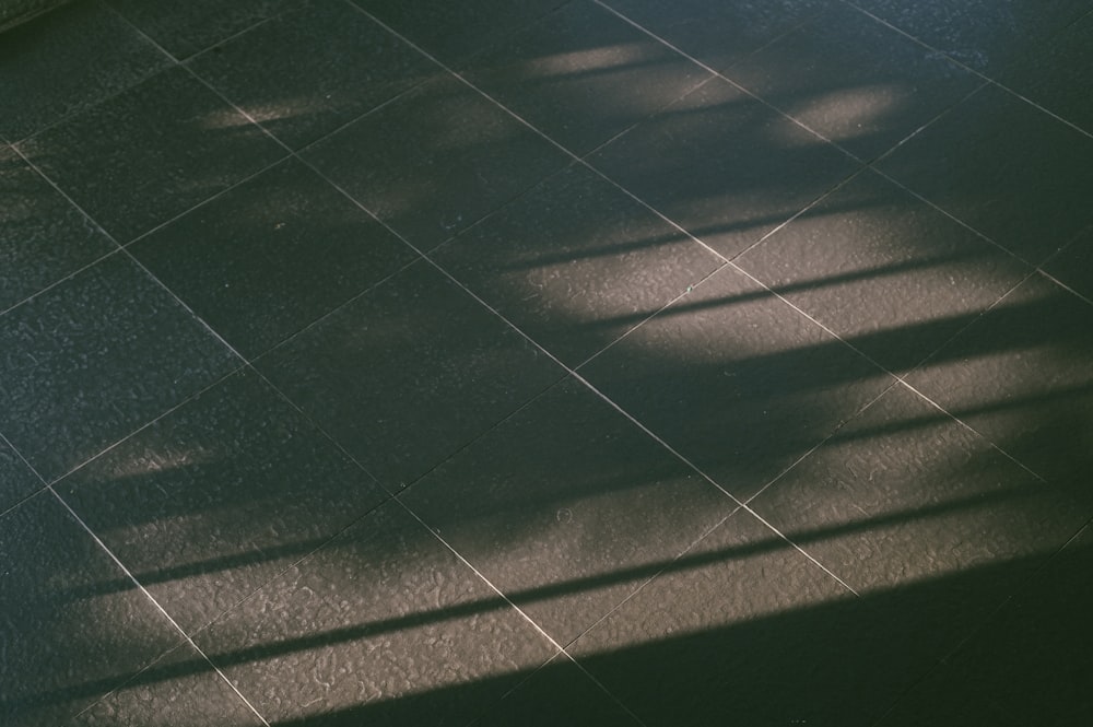 a black and white photo of a tiled floor