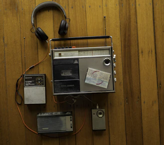 gray and black headphones and boombox
