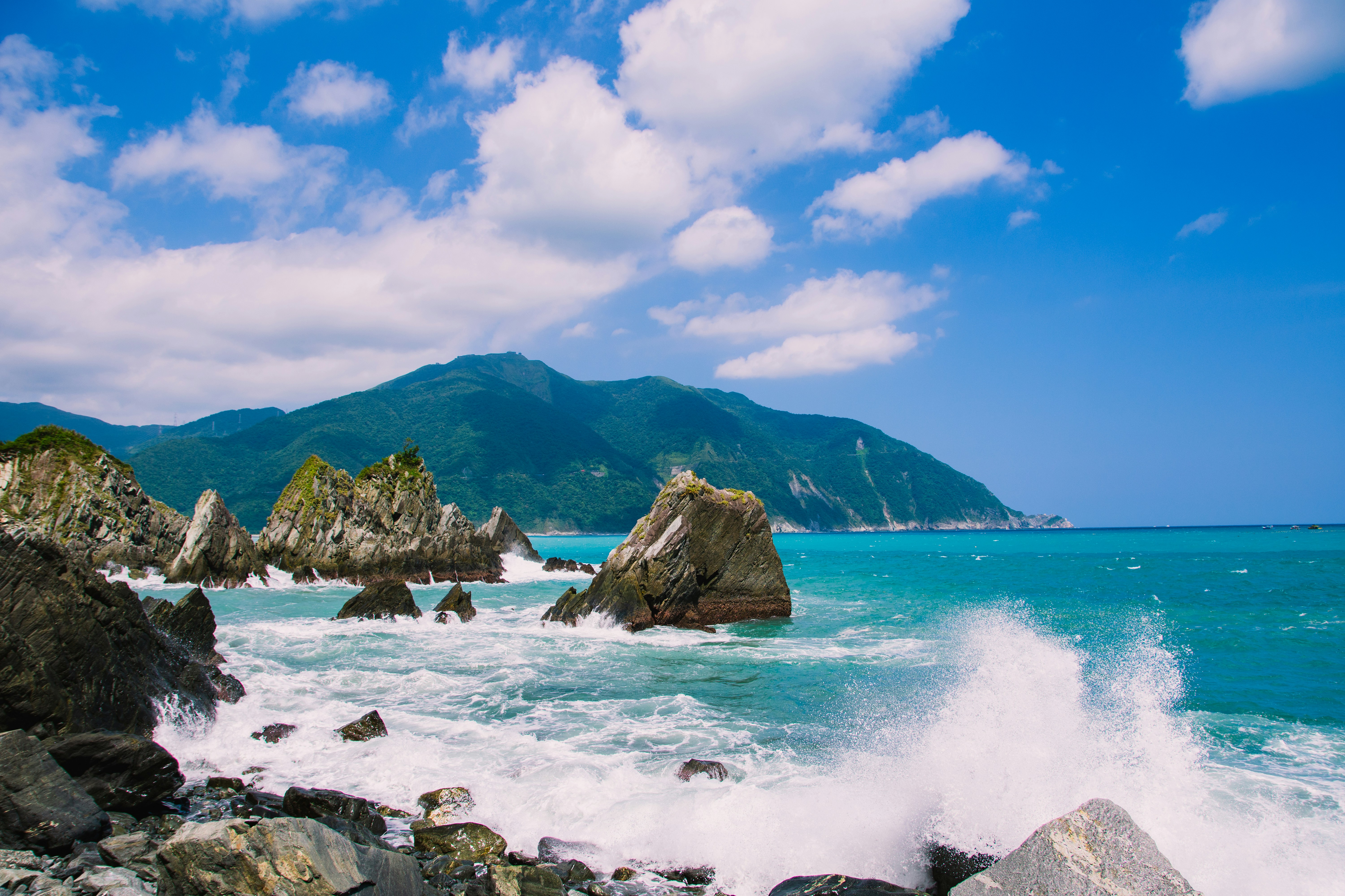 body of water with rock formation