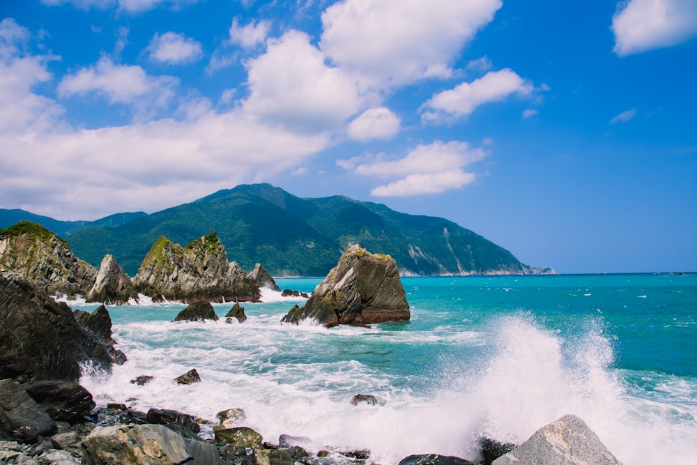 body of water with rock formation