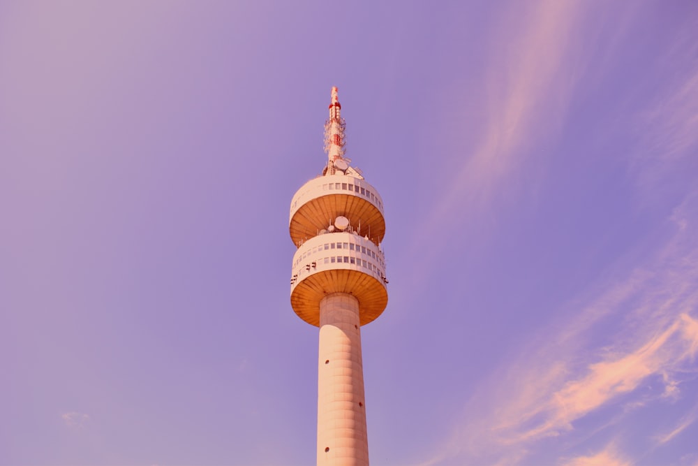 brown concrete tower under gray sky