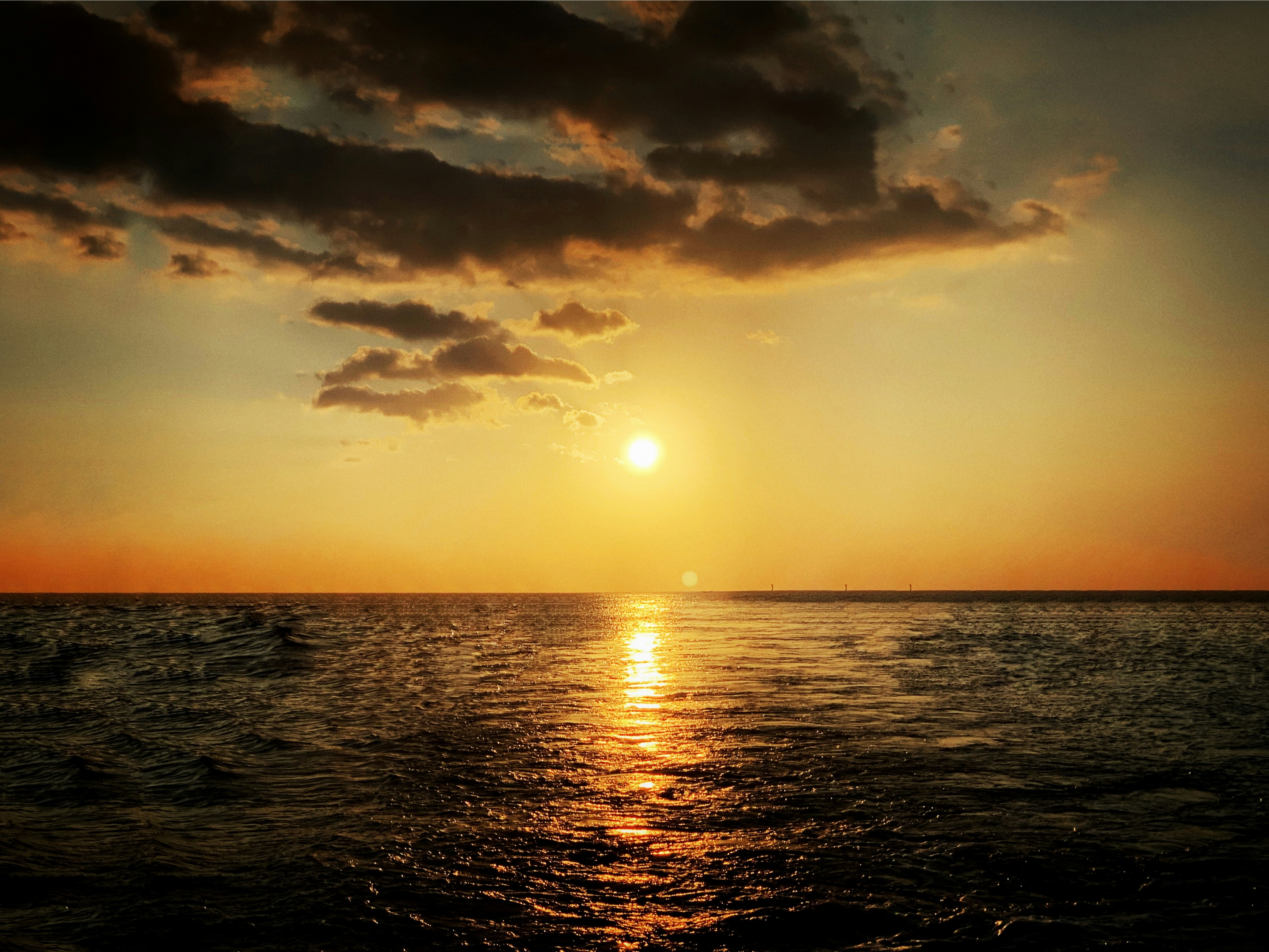 body of water at sunset
