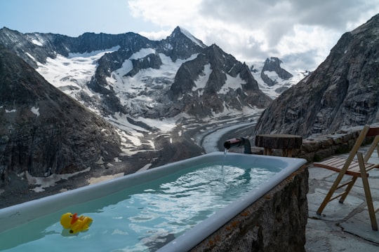 yellow duck toy on pool in Oberaletsch Glacier Switzerland