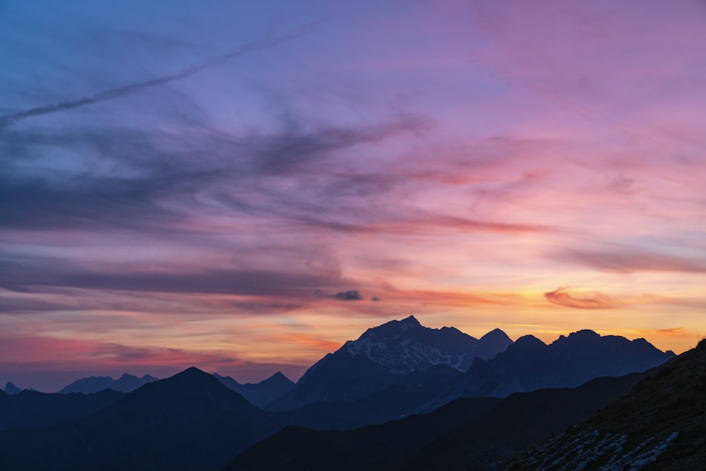 mountain under blue and orange sky