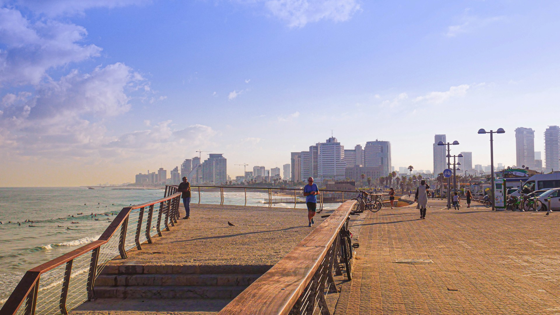 woman wearing yellow long-sleeved dress under white clouds and blue sky during daytime