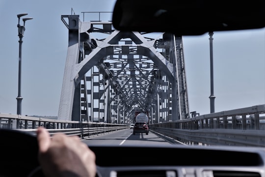 person driving vehicle on bridge in Giurgiu-Rousse Friendship Bridge Bulgaria