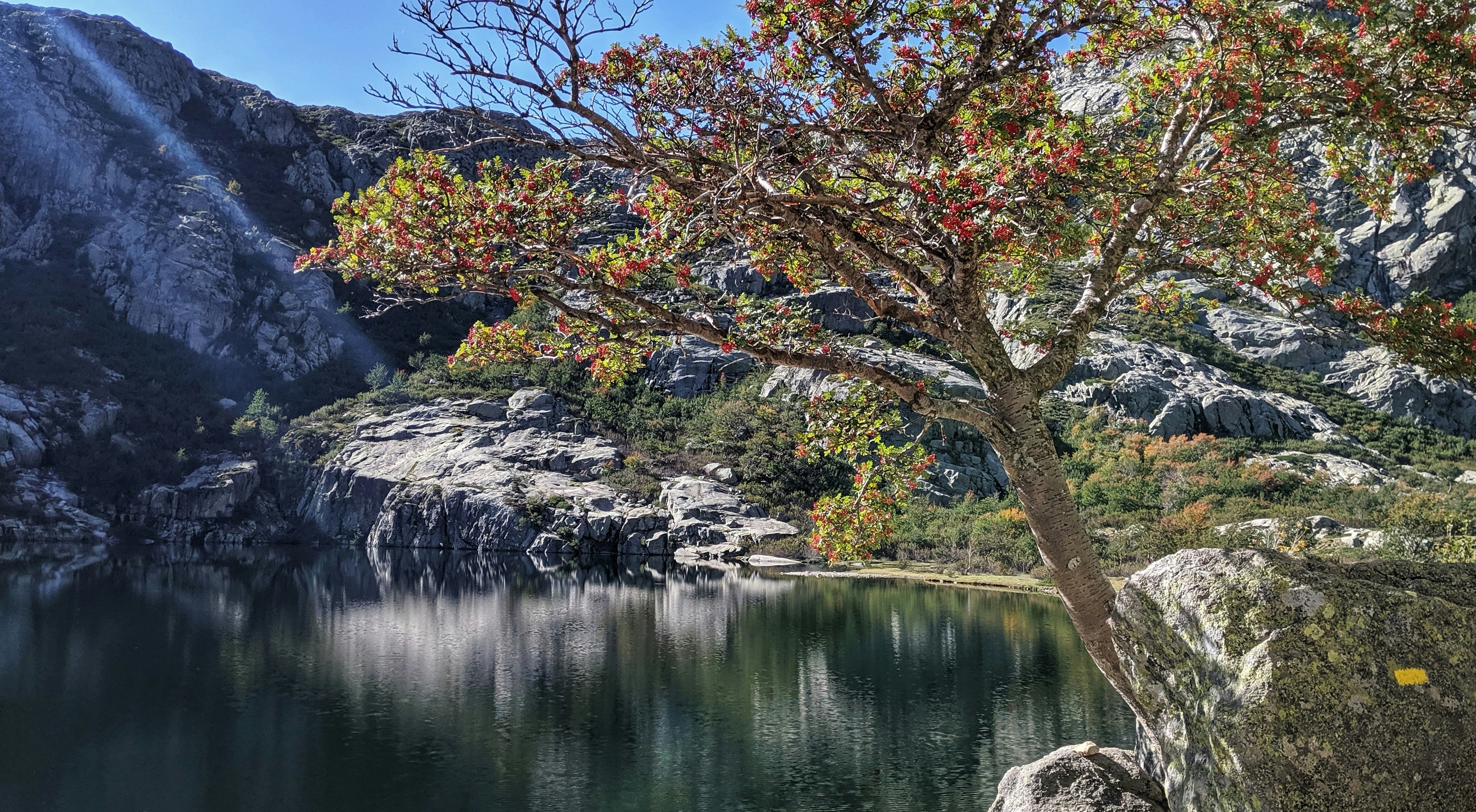 A splash of red across the serene and beautful Lac de Melu; the pay-off from a difficult climb