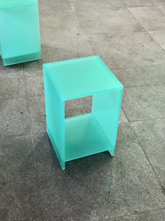 Elegant acrylic display stand showcasing products with clear, polished surfaces.