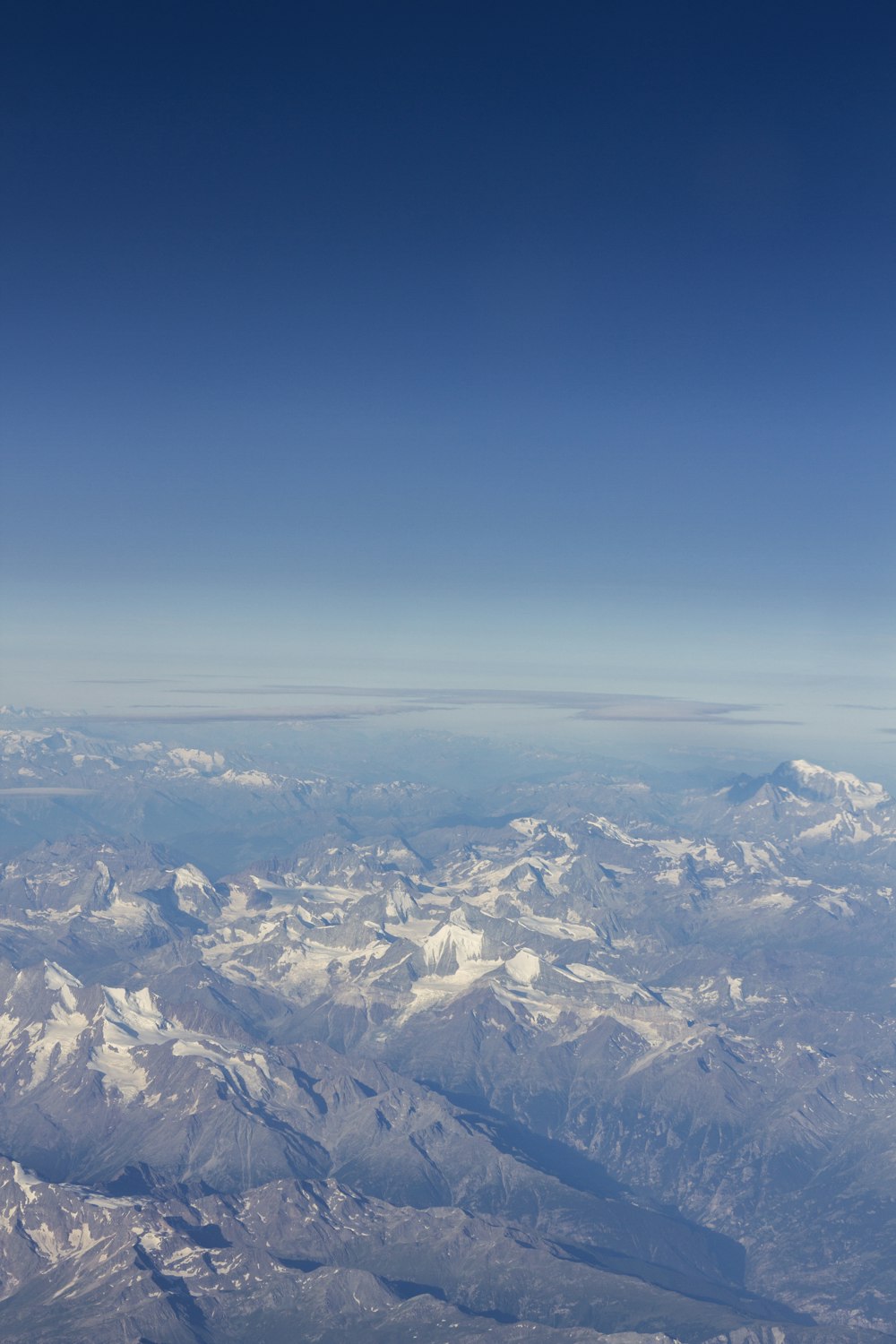 a view of a mountain range from an airplane