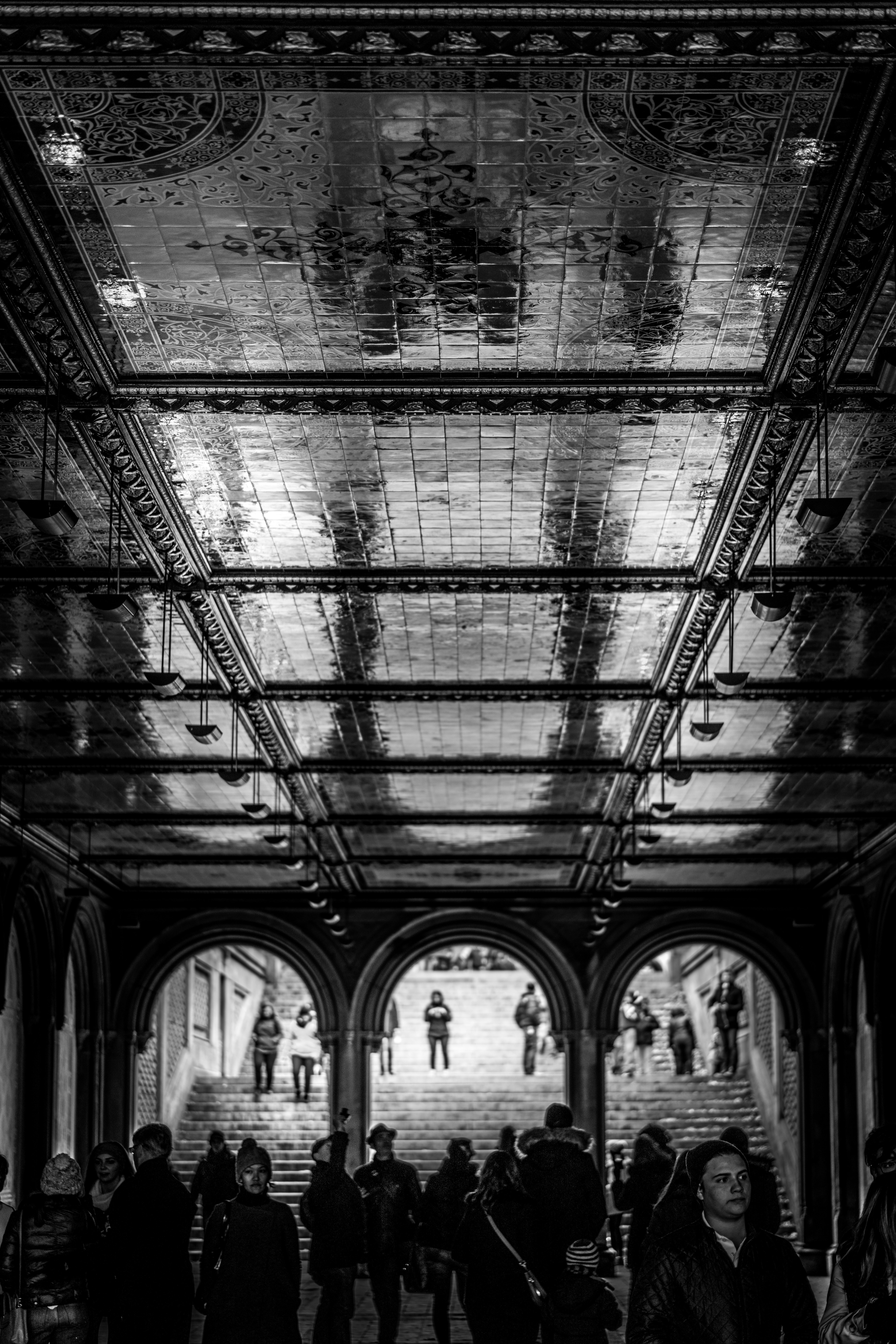 grayscale photography of people inside building