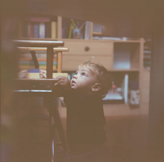 baby wears black long-sleeved shirt