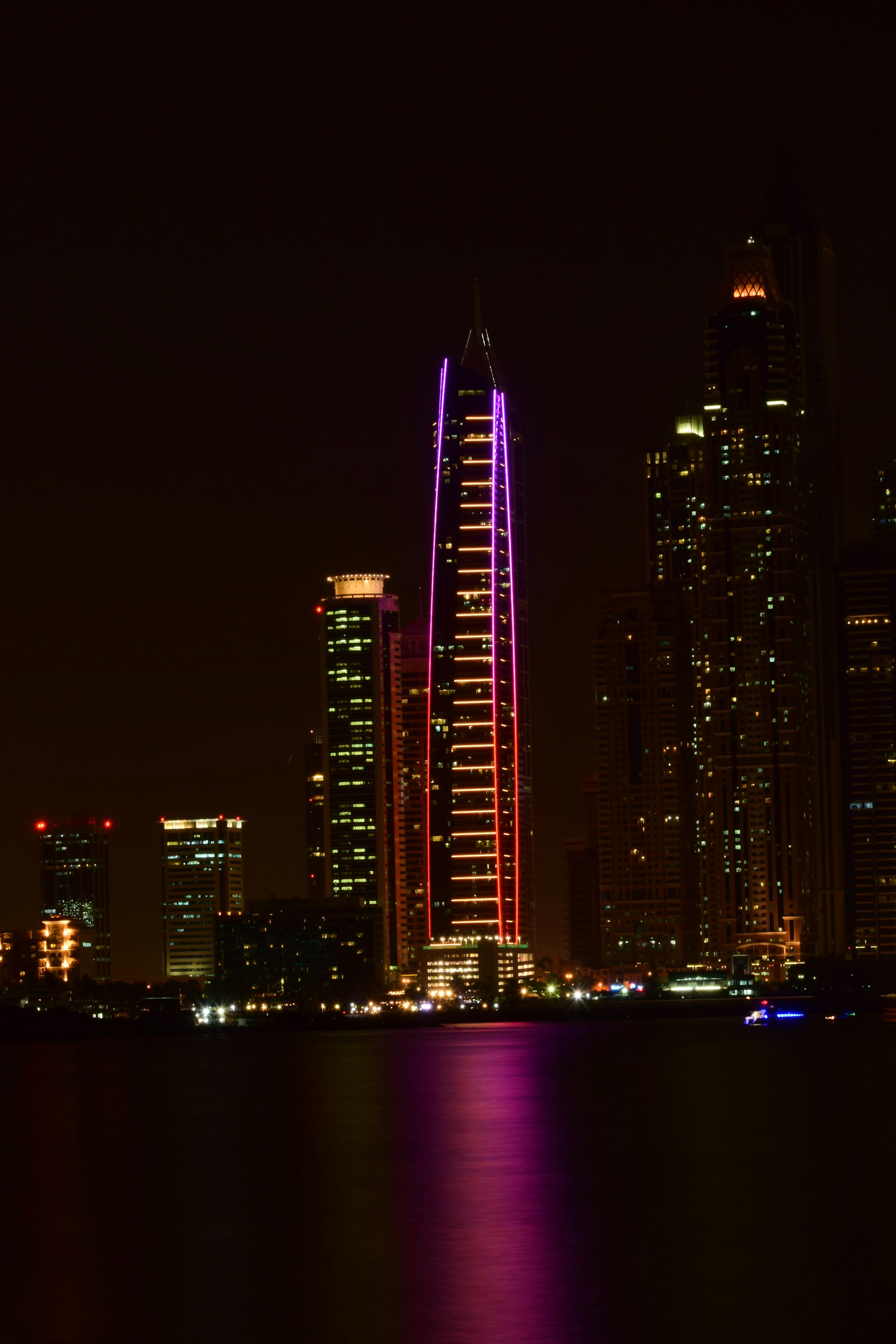 body of water beside buildings