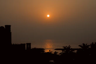 A warm sunset over the peaceful Mediterranean coastline near Cyprus, symbolizing hope and faith.