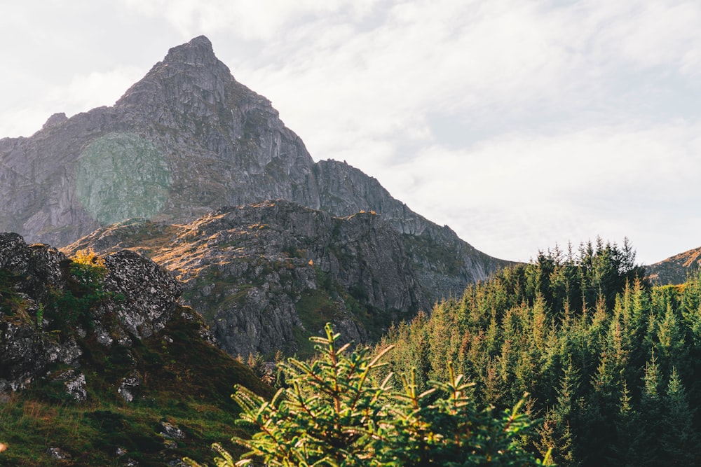 gray mountain under cloudy sky