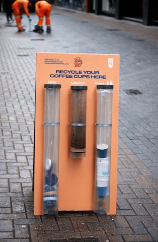 A friendly team member collecting recyclable materials from a customer's home in Xanthi.