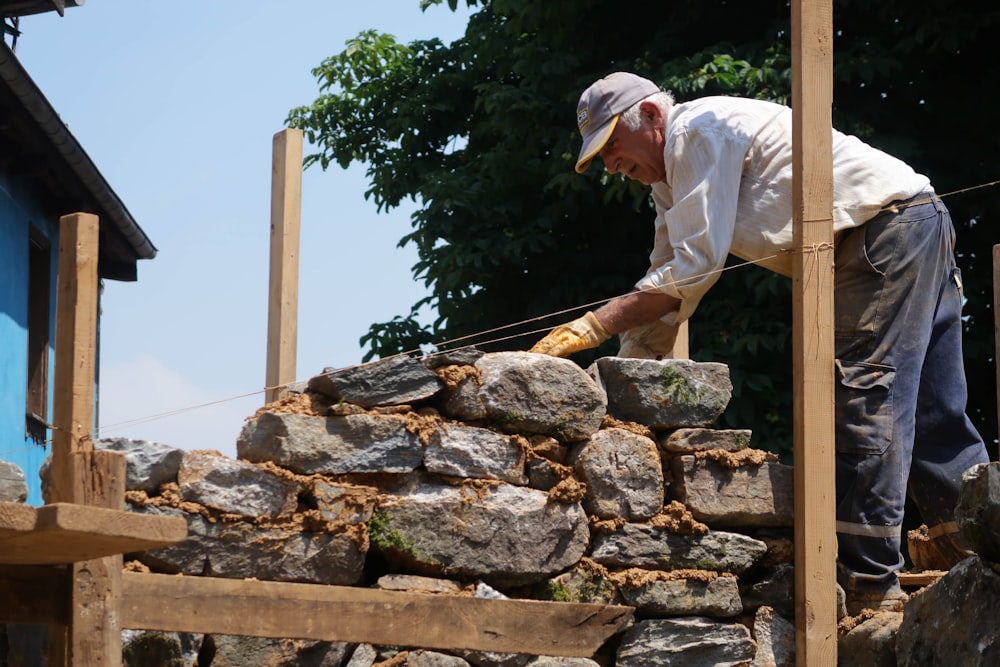 man piling bricks