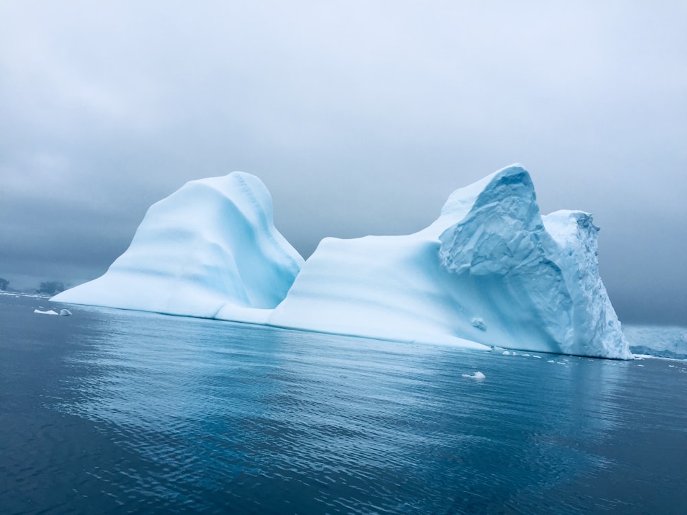 white ice and body of water