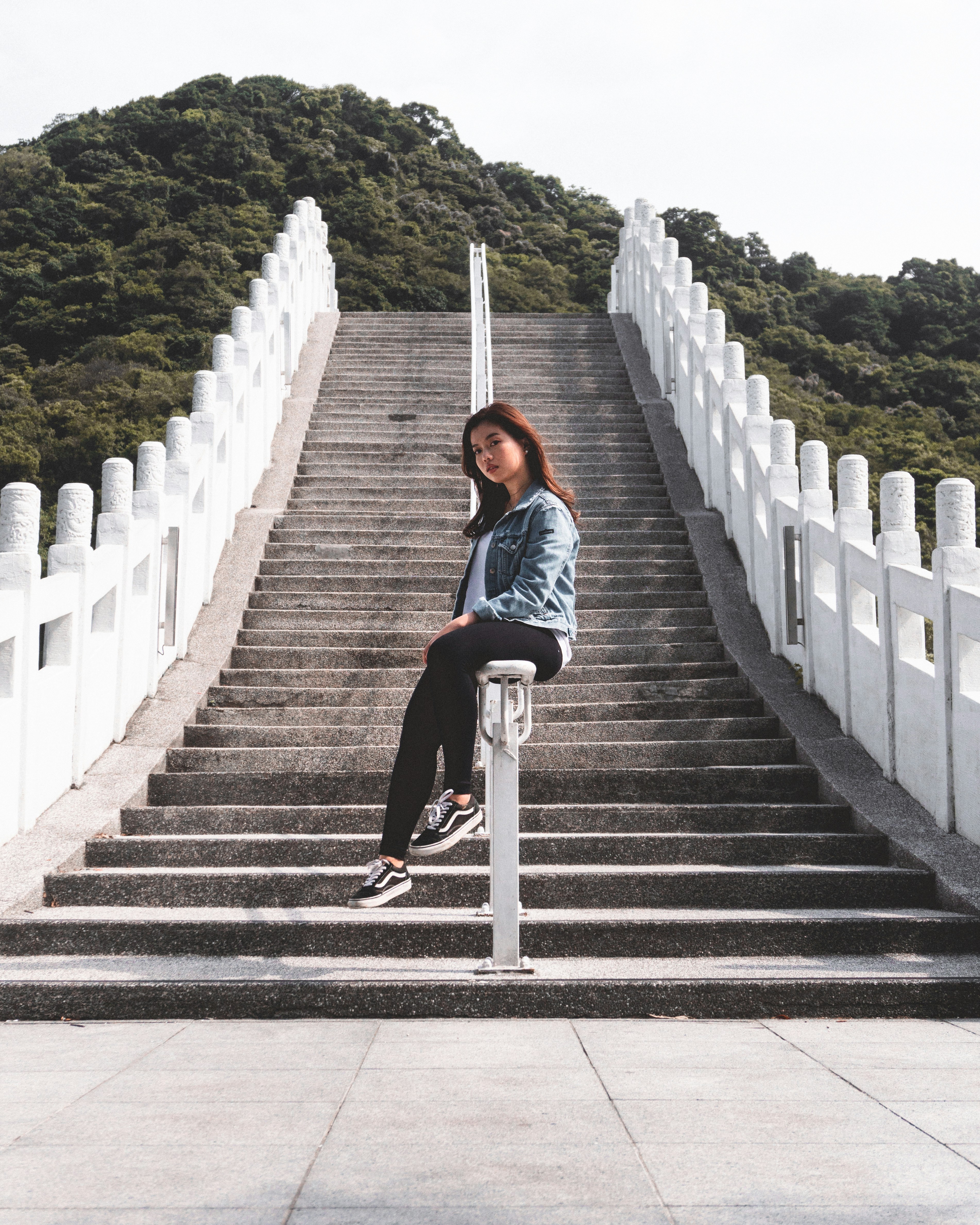 Woman Sitting On Stairway Railings Photo Free Banister Image On
