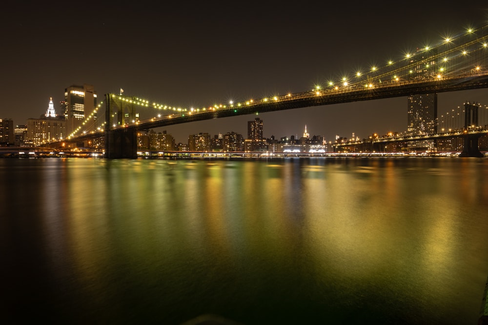 black and brown bridge at nighttime