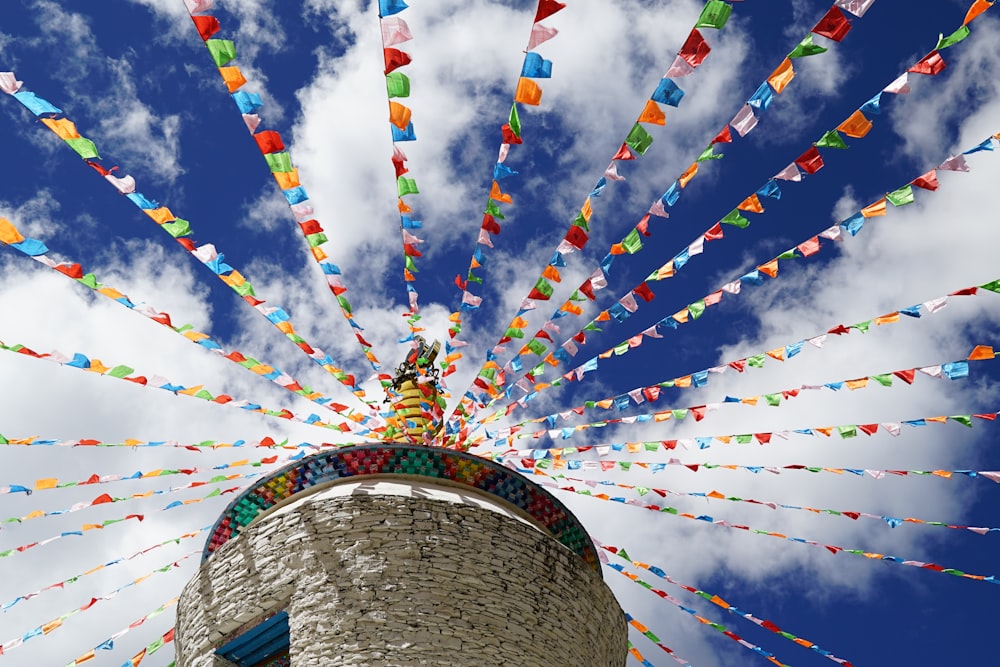 concrete tower with colorful buntings