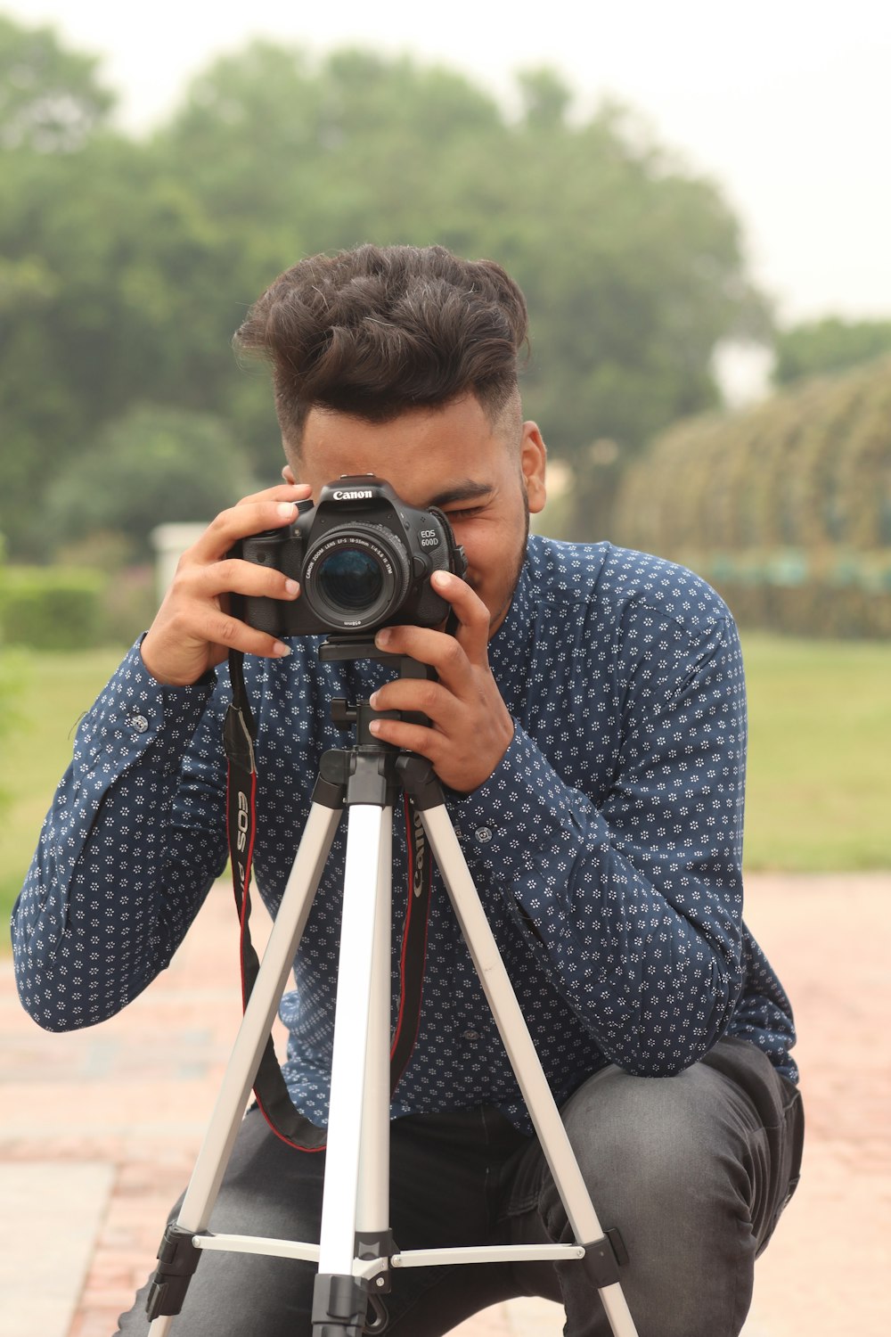 man using DSLR camera