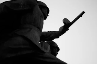 A powerful black and white photo capturing soldiers from different nations sharing a moment of peace during the Gulf War.
