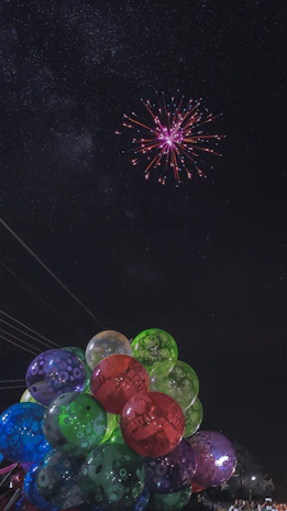 A festive balloon blast moment with vibrant balloons bursting in mid-air, adding excitement to the birthday event.