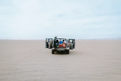 gray 5-door hatchback on desert