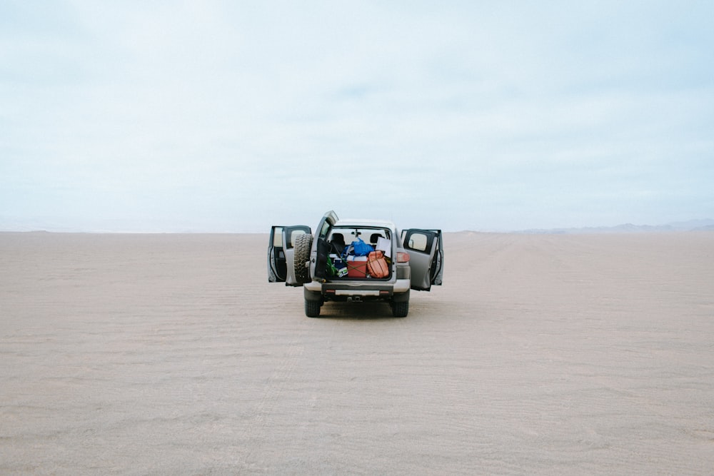 gray 5-door hatchback on desert
