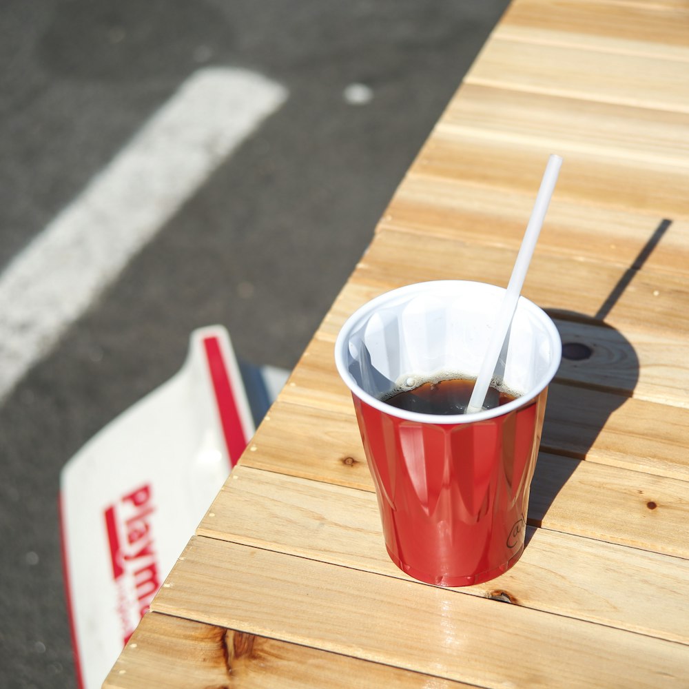 red cup on wooden table