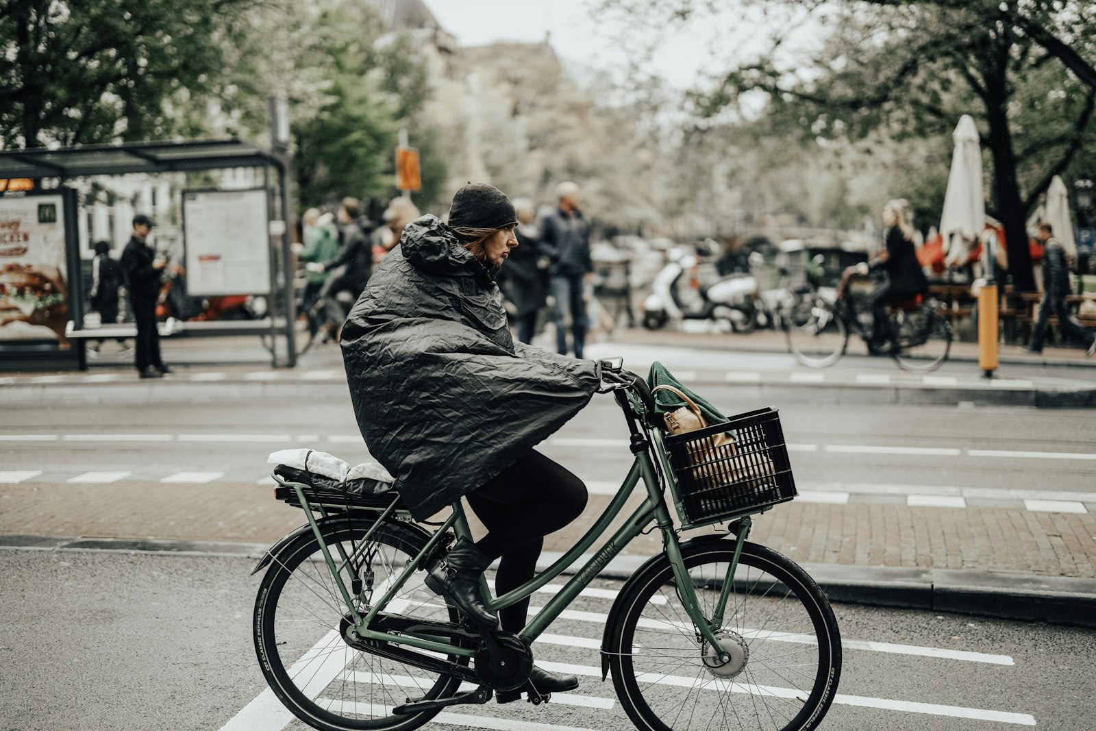 Canon RF 50mm F1.2L USM sample photo. Man riding on bicycle photography