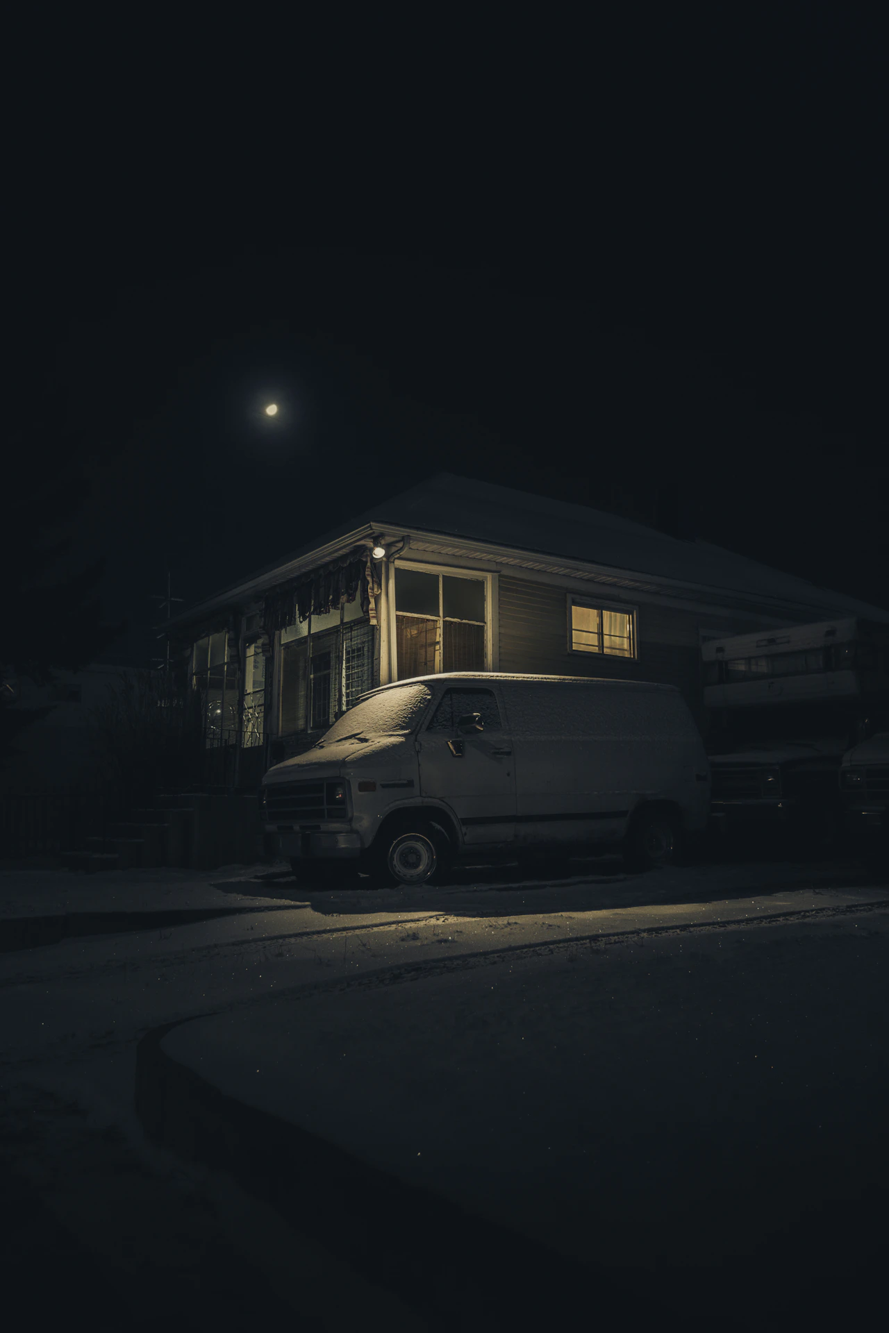 A delivery van parked outside a home after dark, the final stop where confirmation and timestamps close the order