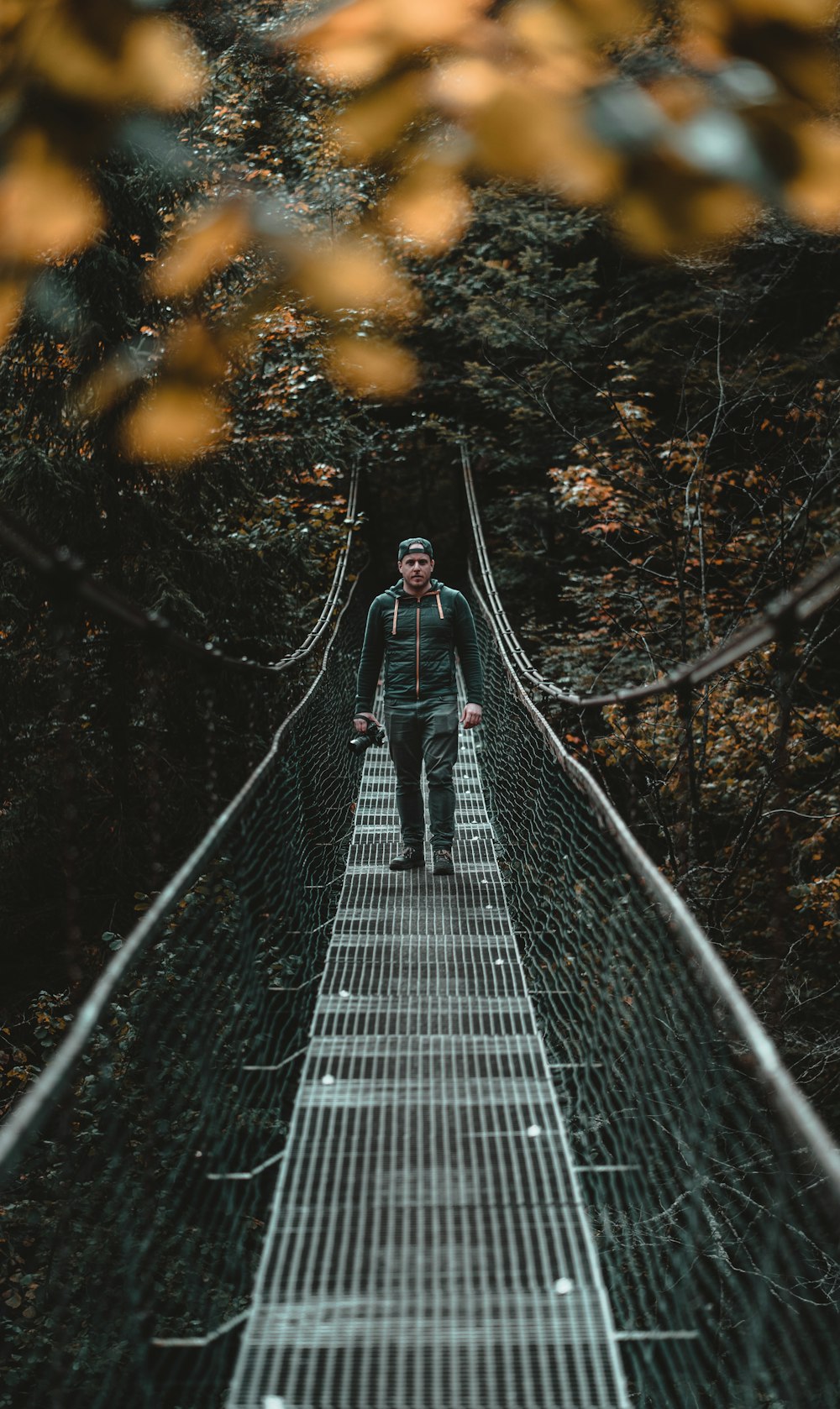 man on a hanging rope bridge