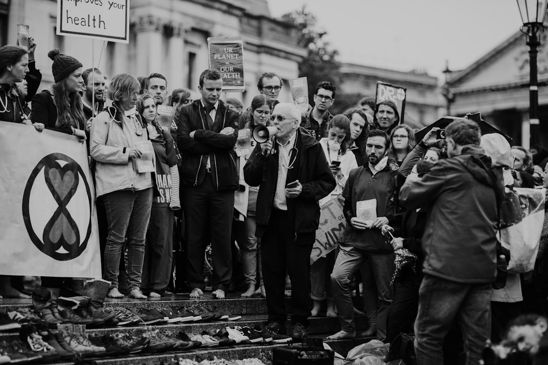 grayscale photography of crowd of people in the street