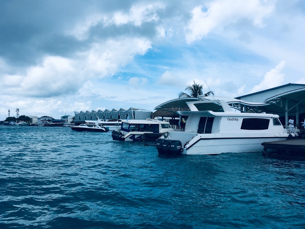 white boat on blue ocean