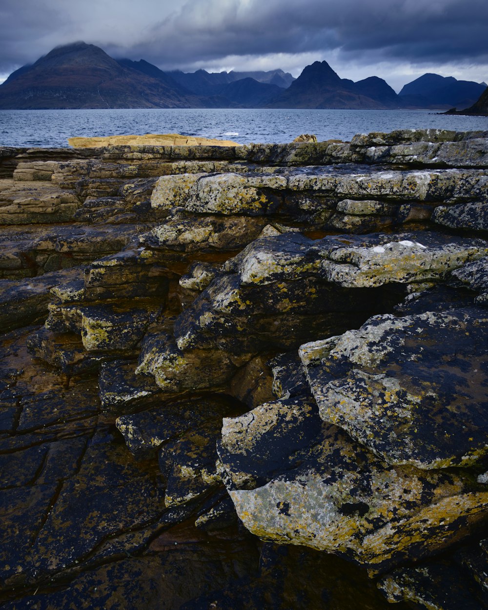 rock formation near calm ocean