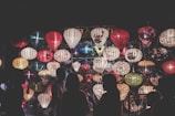 A vibrant photo of a community gathering during Ramadan, with lanterns glowing warmly.