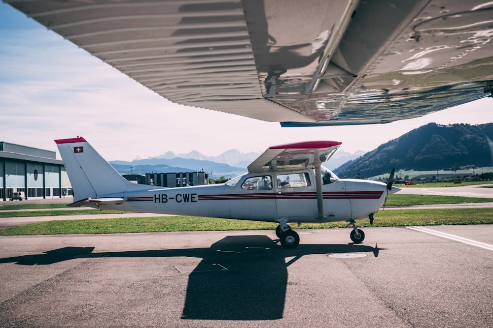 white and red plane during daytime