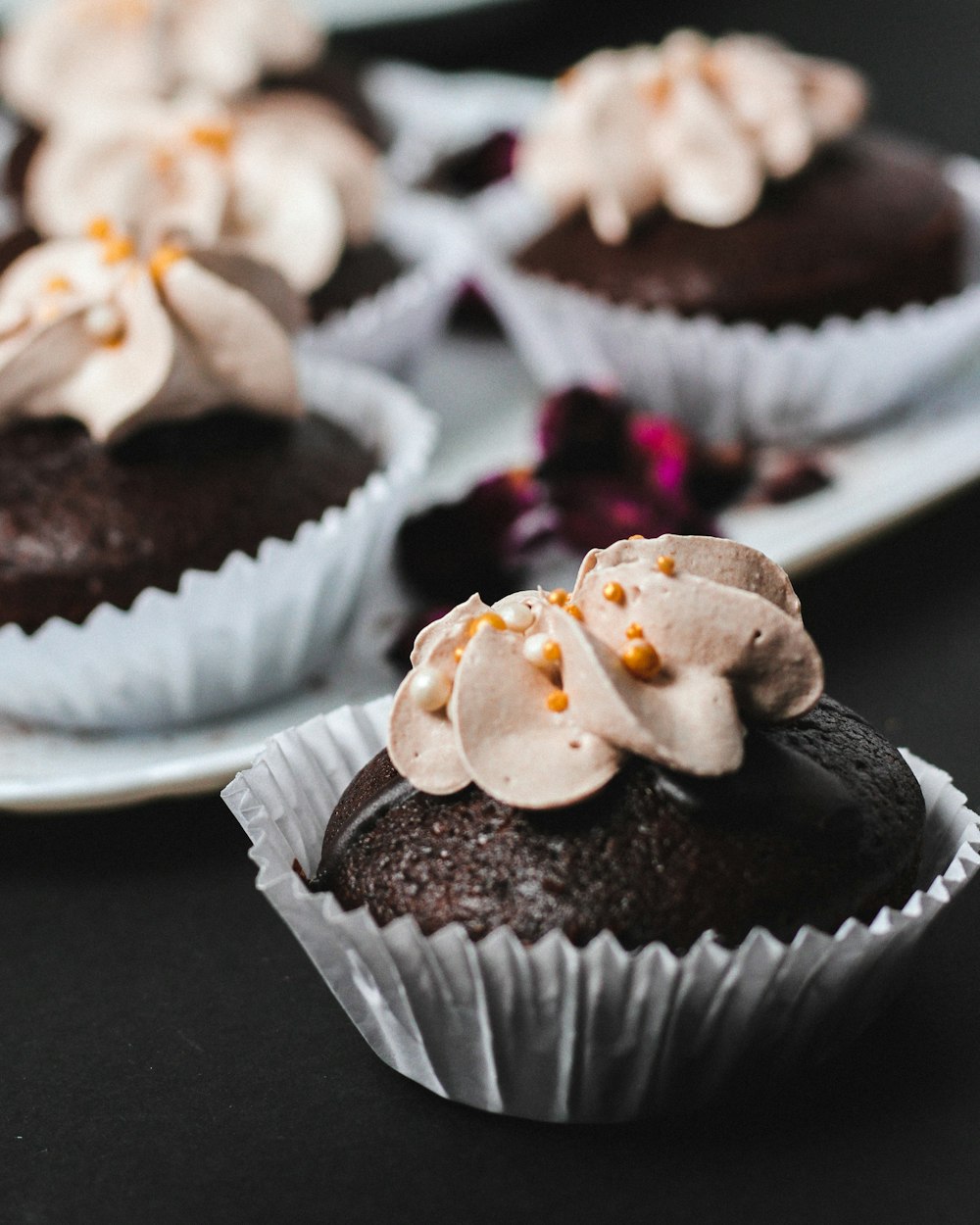 closeup photo of cupcakes with icing on top