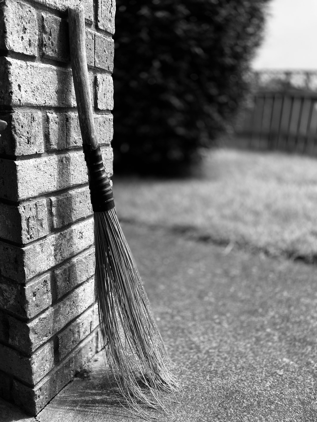  broom place near wall broom