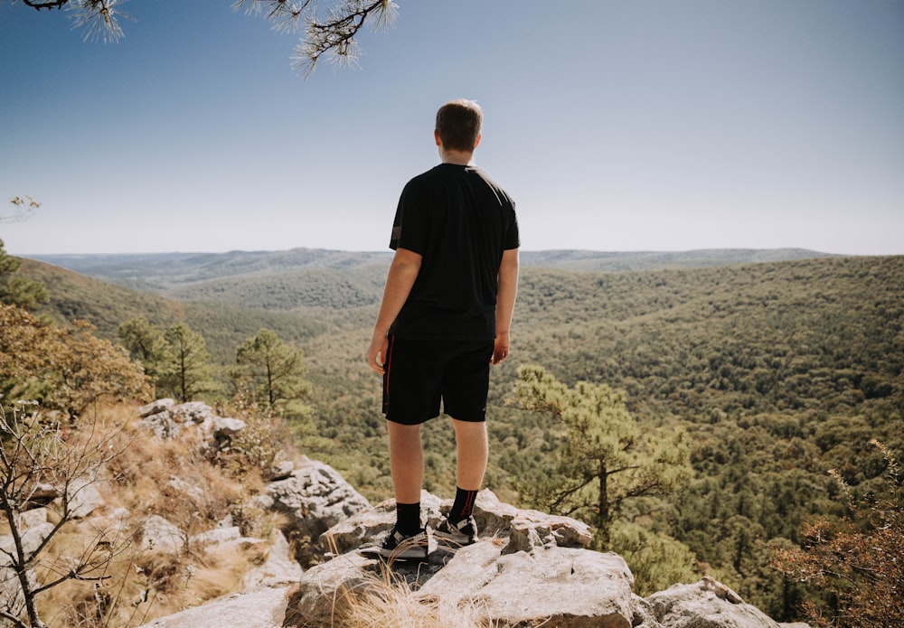 man wears black T-shirt