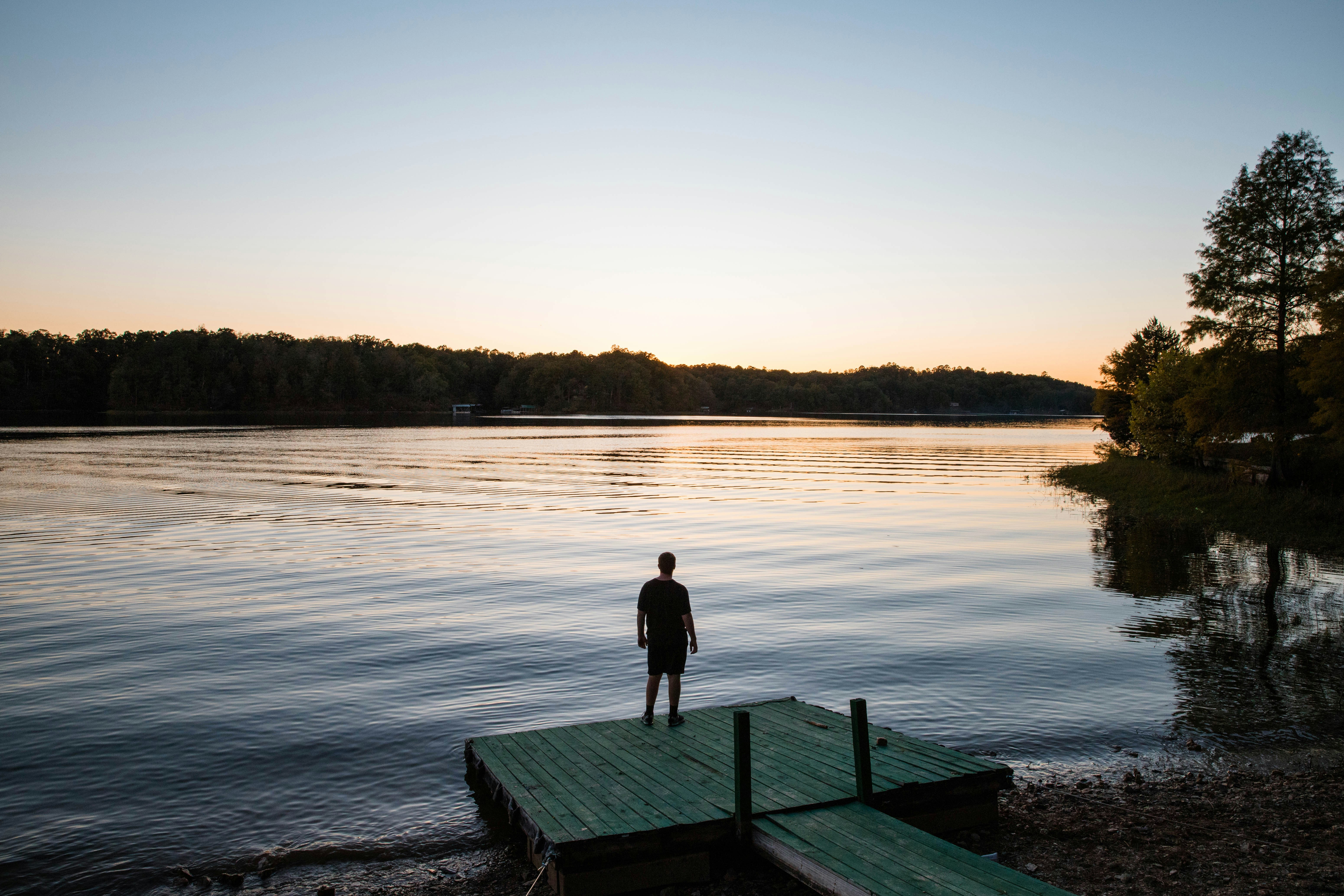 man standing on dock