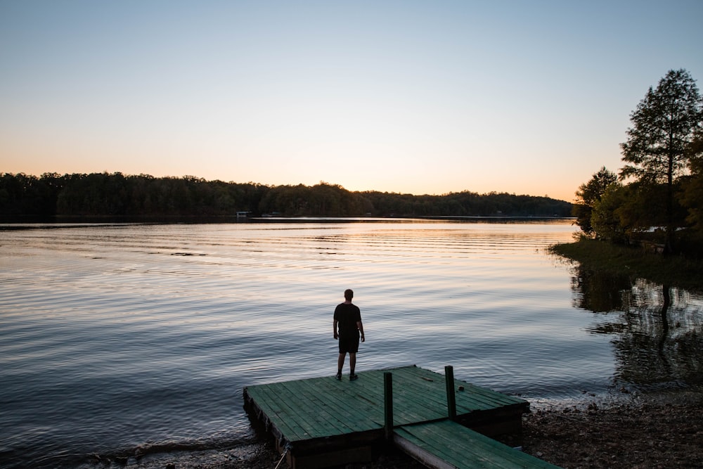 man standing on dock