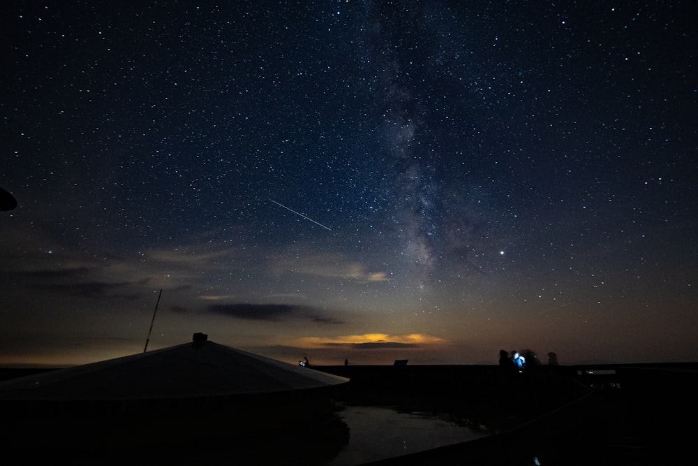 houses under a starry sky during nighttime